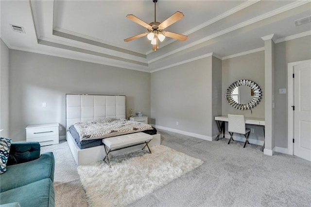 carpeted bedroom featuring a tray ceiling, visible vents, crown molding, and baseboards