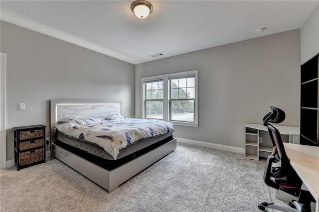 carpeted bedroom with baseboards and visible vents