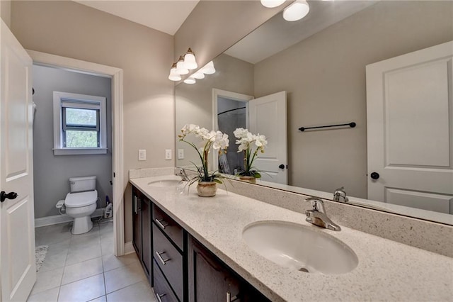 full bathroom with tile patterned flooring, a sink, double vanity, and toilet