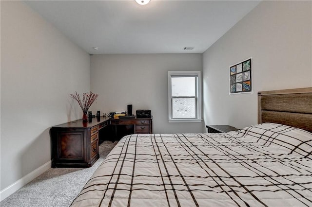 bedroom with visible vents, baseboards, and carpet