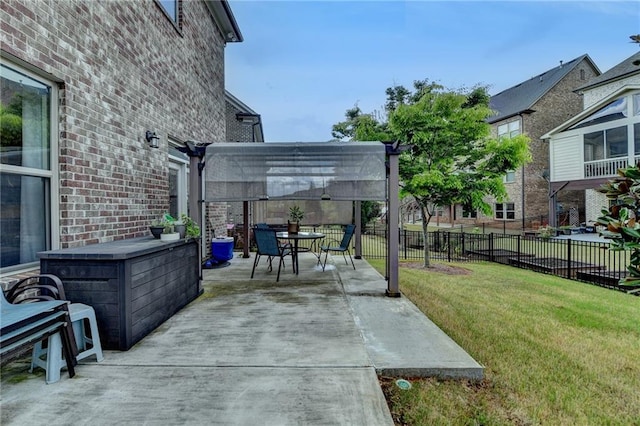 view of patio / terrace featuring fence, outdoor dining space, and a pergola