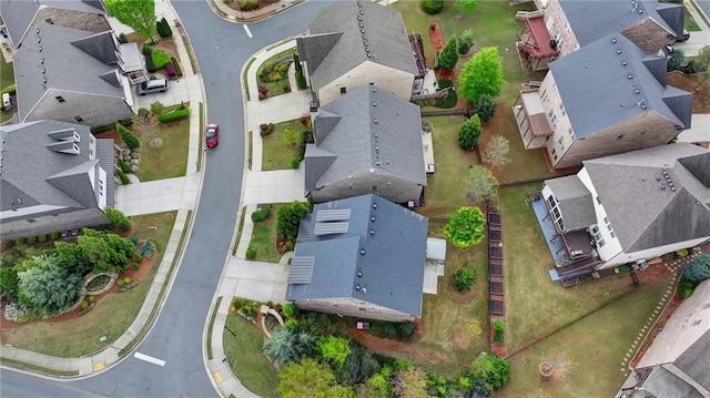 birds eye view of property with a residential view