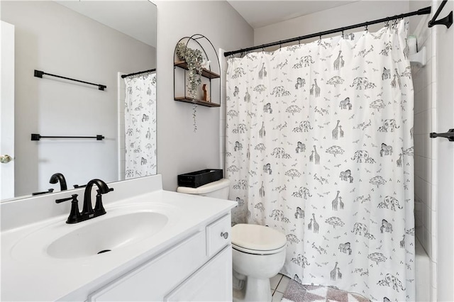 bathroom with toilet and vanity