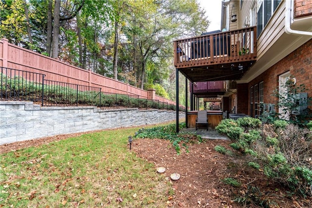 view of yard featuring fence and a wooden deck