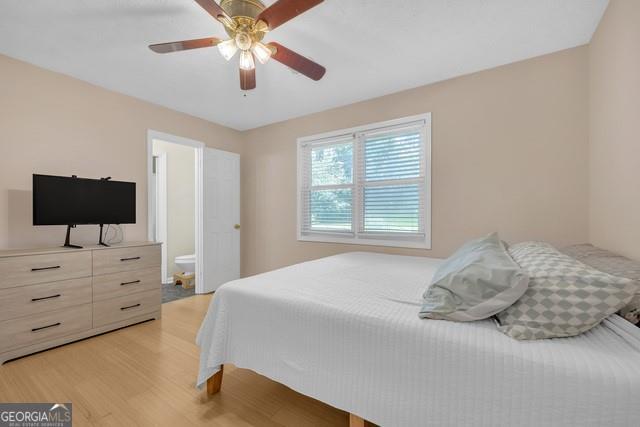 33 Russell Rd, Mcdonough, GA 30252 - bedroom with light wood finished floors and ceiling fan