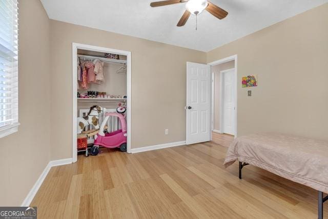 33 Russell Rd, Mcdonough, GA 30252 - bedroom with wood finished floors, a closet, and a ceiling fan