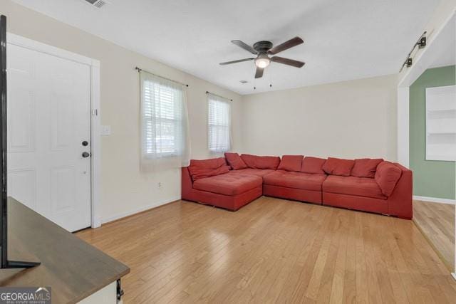 33 Russell Rd, Mcdonough, GA 30252 - living room featuring a ceiling fan and light wood-style flooring