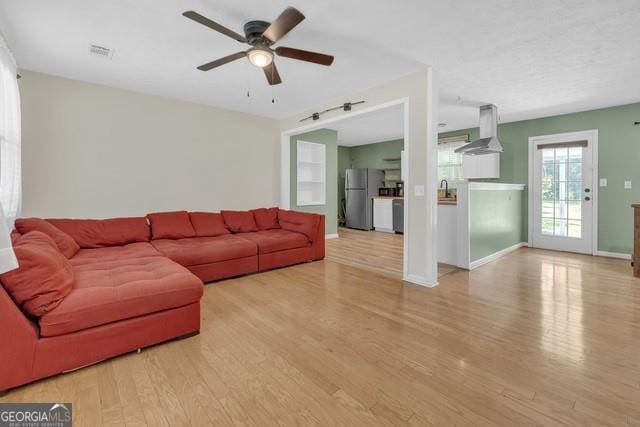 33 Russell Rd, Mcdonough, GA 30252 - living area with wood finished floors and ceiling fan