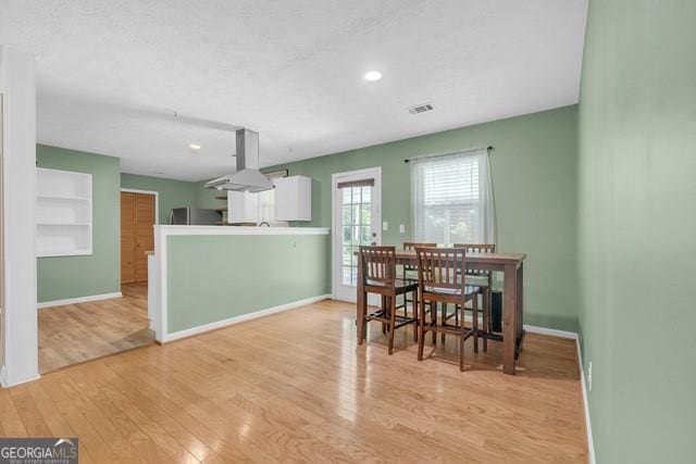 33 Russell Rd, Mcdonough, GA 30252 - dining room with wood finished floors, built in features, and recessed lighting