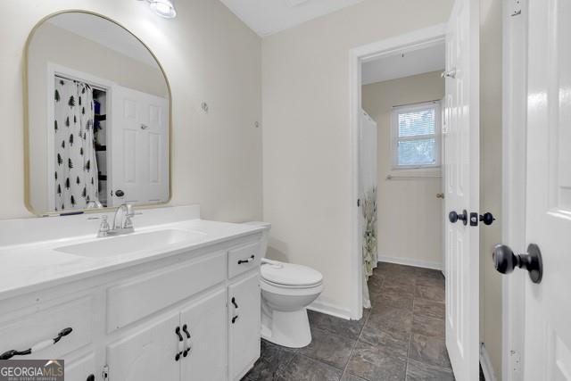 33 Russell Rd, Mcdonough, GA 30252 - full bathroom with vanity and stone finish flooring