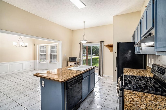 2928 Riverset Ct, Decatur, GA 30034 - kitchen featuring black appliances, under cabinet range hood, blue cabinetry, a chandelier, and decorative light fixtures