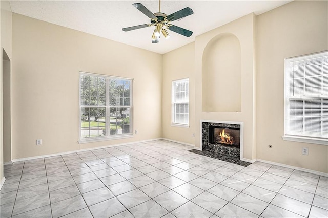 2928 Riverset Ct, Decatur, GA 30034 - unfurnished living room featuring a premium fireplace, ceiling fan, and light tile patterned floors