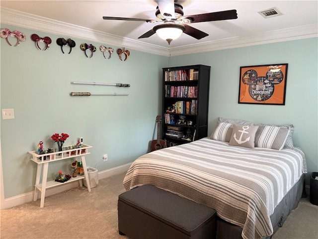 carpeted bedroom featuring baseboards, visible vents, ornamental molding, and a ceiling fan