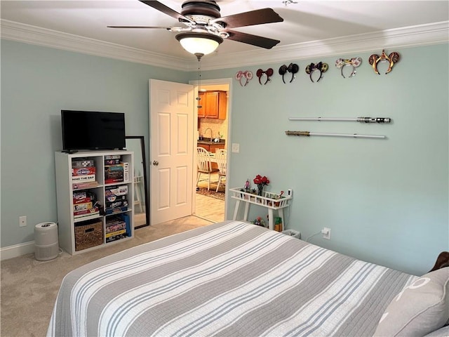 bedroom with baseboards, ornamental molding, a ceiling fan, and light carpet