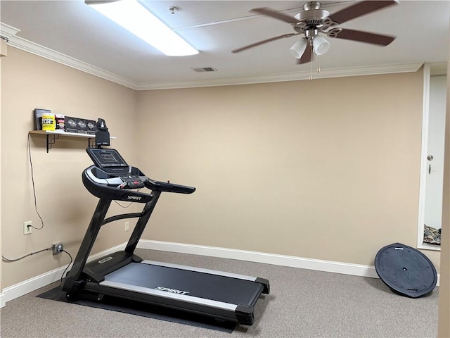 exercise area featuring baseboards, visible vents, crown molding, and a ceiling fan