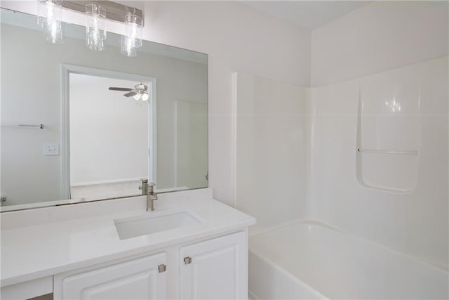 full bathroom with ceiling fan, bathing tub / shower combination, and vanity