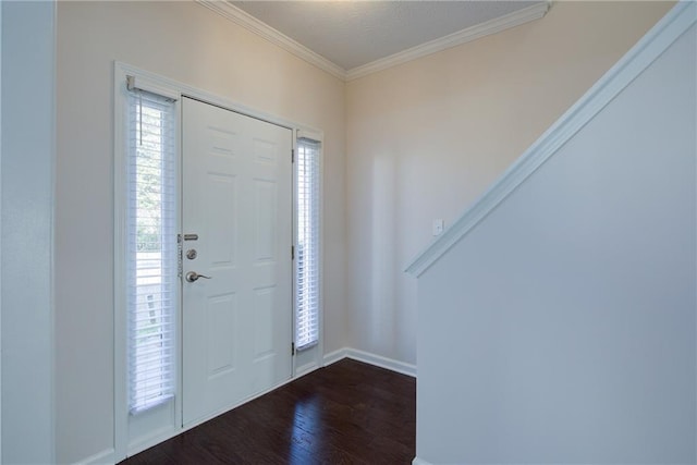 entryway featuring dark wood-style floors, baseboards, and crown molding