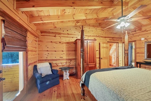 bedroom with hardwood / wood-style floors, wooden walls, wood ceiling, ceiling fan, and lofted ceiling with beams