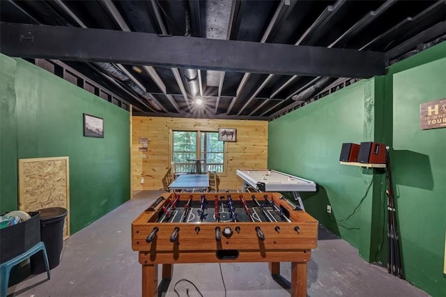 recreation room featuring concrete floors