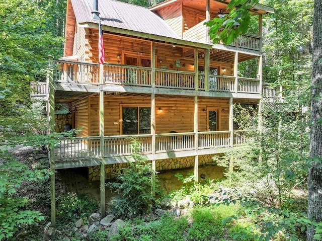 view of side of property with a balcony