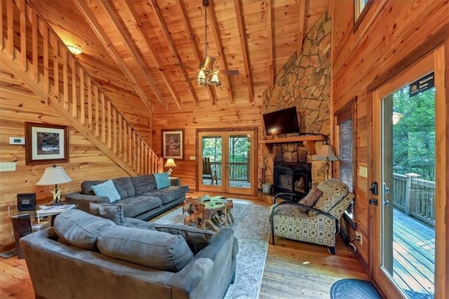 living room featuring plenty of natural light, wood-type flooring, and wooden ceiling