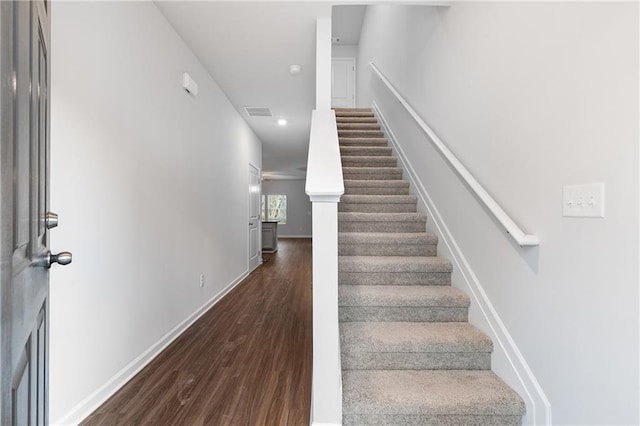 staircase featuring hardwood / wood-style flooring