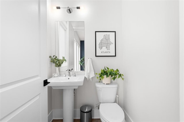 bathroom featuring sink and toilet