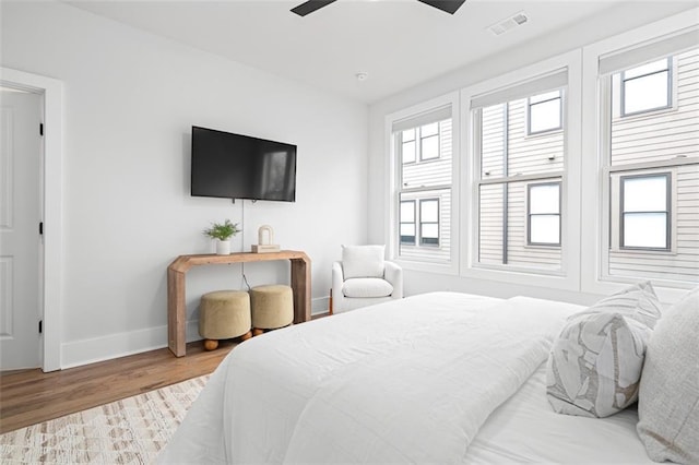 bedroom featuring ceiling fan and light hardwood / wood-style flooring