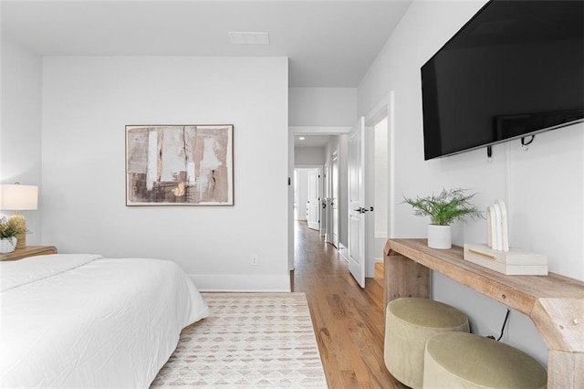 bedroom with light wood-type flooring