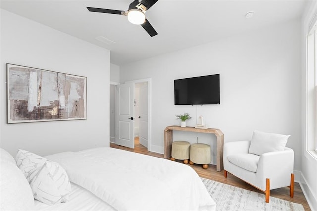 bedroom featuring ceiling fan and light wood-type flooring