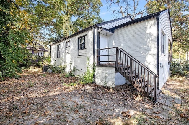 3060 Washington Rd, Atlanta, GA 30344 - rear view of house featuring brick siding and cooling unit
