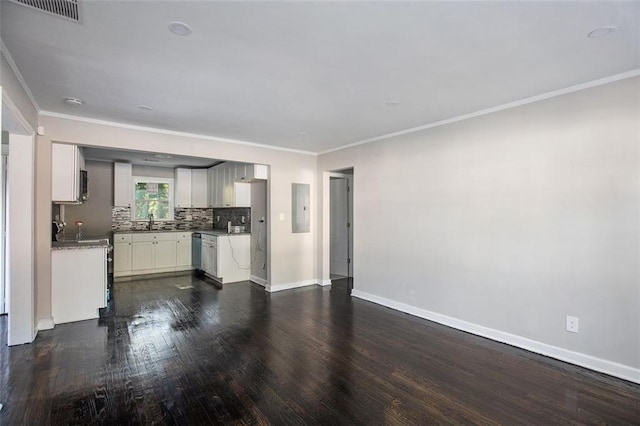3060 Washington Rd, Atlanta, GA 30344 - unfurnished living room featuring electric panel, dark wood finished floors, crown molding, baseboards, and a sink