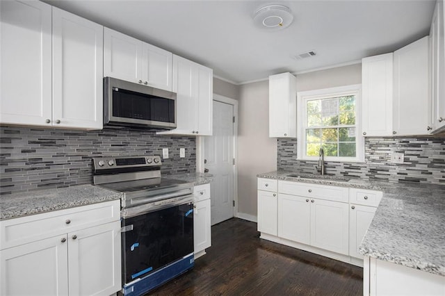 3060 Washington Rd, Atlanta, GA 30344 - kitchen featuring stainless steel appliances, a sink, dark wood-style floors, backsplash, and light stone counters