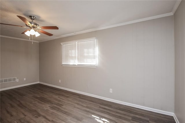 unfurnished room featuring ornamental molding, dark wood-style flooring, visible vents, and a ceiling fan