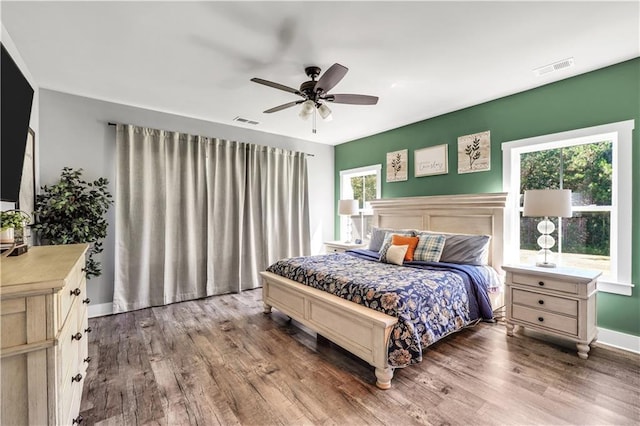 bedroom with wood-type flooring and ceiling fan