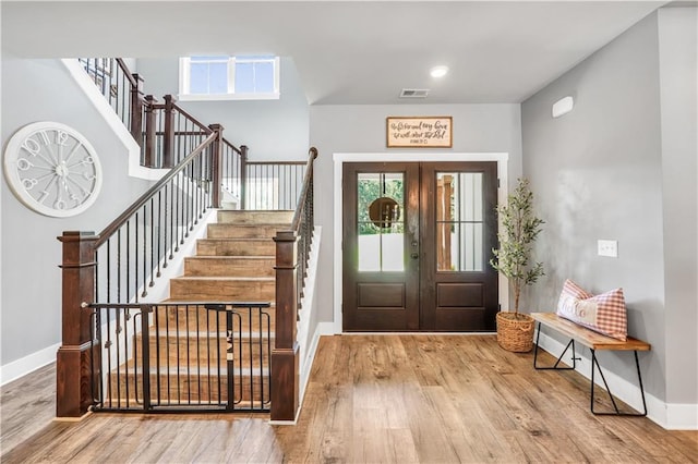 entrance foyer with wood-type flooring and french doors