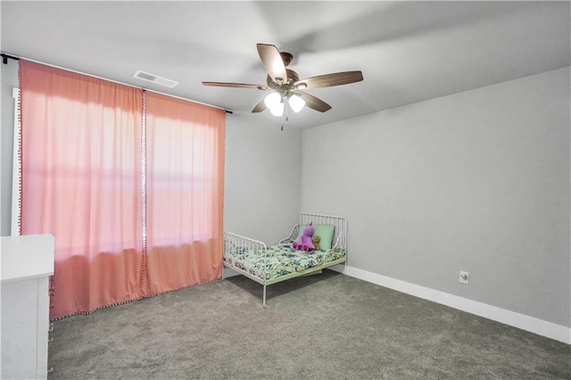 unfurnished bedroom featuring ceiling fan and carpet flooring