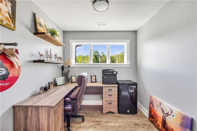 office space with light hardwood / wood-style flooring