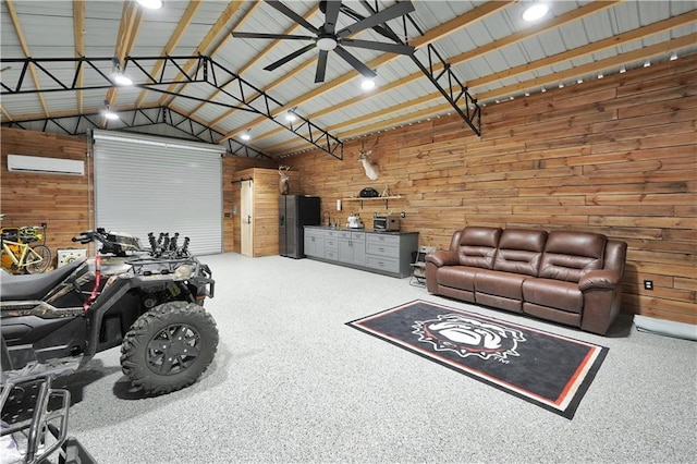 garage featuring ceiling fan, wooden walls, and a wall mounted AC