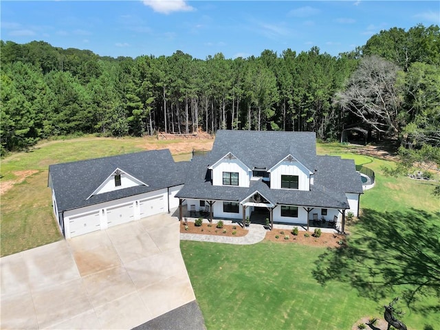 view of front of home with a garage and a front lawn