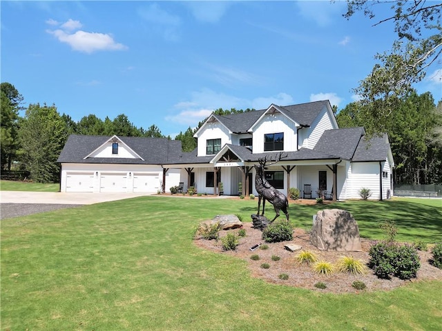 view of front of home featuring a garage and a front lawn