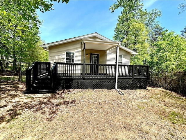 manufactured / mobile home featuring fence and a deck