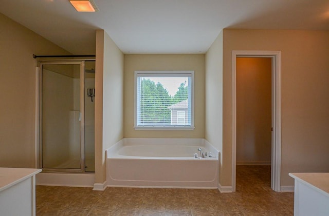 4032 Duran Ln, Auburn, GA 30011 - full bathroom featuring vanity, a bath, a stall shower, and tile patterned flooring