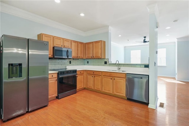 6887 Slate Stone Way SE Unit 3, Mableton, GA 30126 - kitchen with stainless steel appliances, a sink, crown molding, light countertops, and light wood-style floors