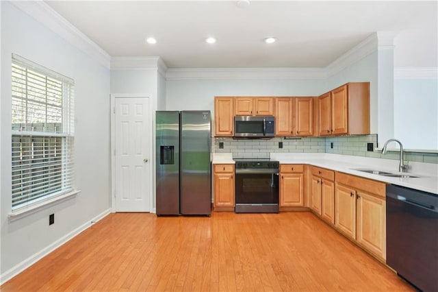 6887 Slate Stone Way SE Unit 3, Mableton, GA 30126 - kitchen featuring black appliances, a sink, light countertops, light wood finished floors, and crown molding