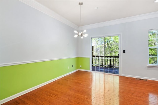 6887 Slate Stone Way SE Unit 3, Mableton, GA 30126 - unfurnished room with ornamental molding, wood finished floors, baseboards, and a chandelier