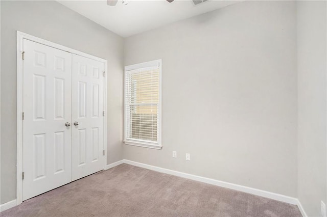 400 Bass St SW, Atlanta, GA 30310 - unfurnished bedroom featuring carpet floors, baseboards, a closet, and ceiling fan