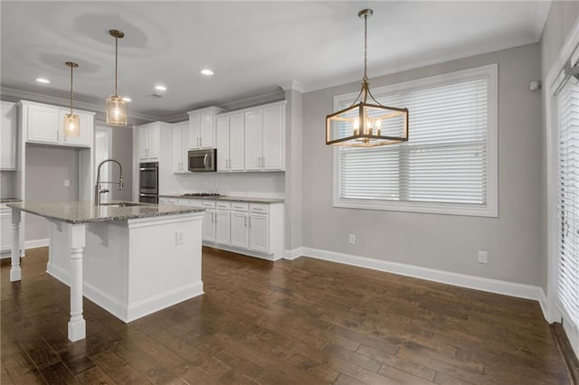 4204 Hardy Ave, Smyrna, GA 30082 - kitchen with appliances with stainless steel finishes, baseboards, white cabinets, light stone counters, and recessed lighting