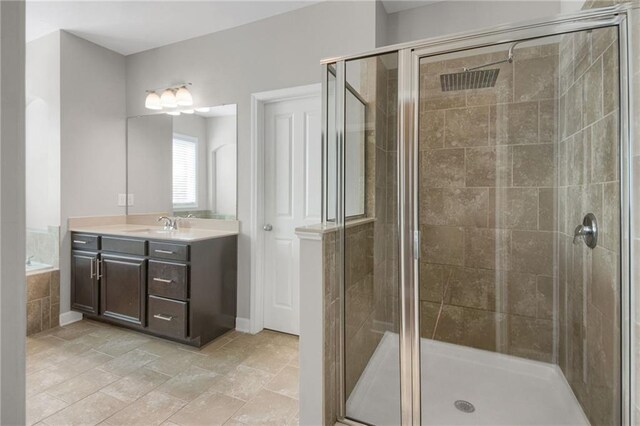 4204 Hardy Ave, Smyrna, GA 30082 - bathroom with a bath, two vanities, and tile patterned flooring