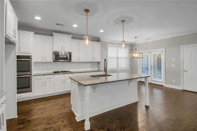 4204 Hardy Ave, Smyrna, GA 30082 - kitchen with stainless steel appliances, a sink, decorative backsplash, white cabinetry, and crown molding